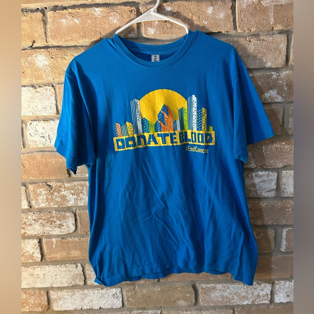 MD Anderson “Donate Blood” Blue and Yellow Graphic Tee. Size LG.